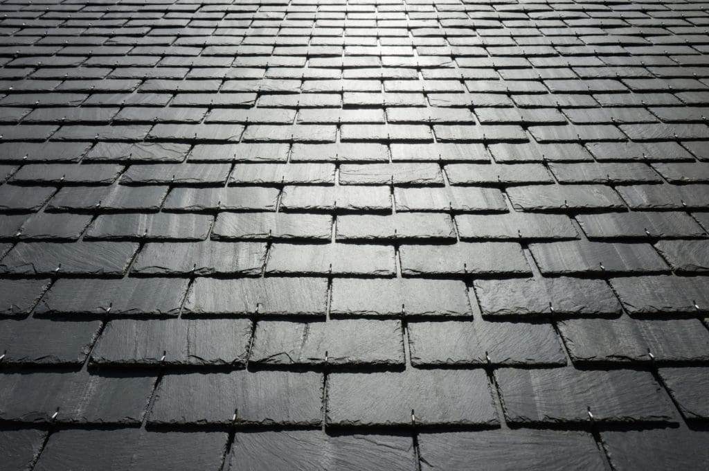 A slate roof reflecting the sunlight.