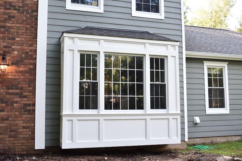 window installation project on blue home by blue nail exteriors